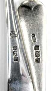A George V napkin ring, Birmingham 1930, further napkin ring, bearing indistinct marks, and two silver teaspoons, 2.86oz. (4) - 3