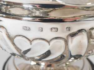 An Edward Vii silver pedestal bowl, with a frilled rim, embossed floral and foliate decoration, on a stepped circular foot, Birmingham 1904, 10.10oz, on a socle with a presentation plaque. - 3
