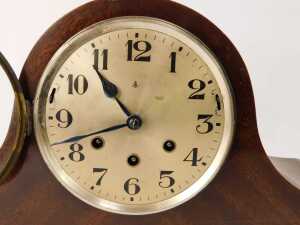 An early 20thC mahogany cased Napoleon hat mantle clock, the silvered circular dial bearing Arabic numerals, eight day movement with Westminster chime, with key, 26cm high. - 2