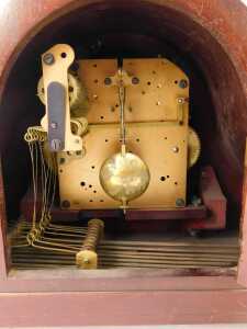 An early 20thC mahogany cased Napoleon hat mantle clock, the silvered circular dial bearing Arabic numerals, eight day movement with Westminster chime, with key, 26cm high. - 3