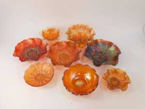 A group of carnival glass, to include orange glass pedestal dish, 21cm diameter, two handled dish, 16cm wide, etc. - 2