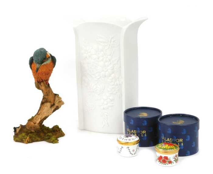 A Kaiser bisque porcelain vase, relief decorated with flowers, printed marks, 24cm high, together with a Country Artists figure modelled as a kingfisher on branch, 19cm high, and two Alastor enamel pill boxes.