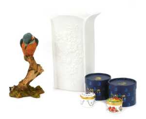 A Kaiser bisque porcelain vase, relief decorated with flowers, printed marks, 24cm high, together with a Country Artists figure modelled as a kingfisher on branch, 19cm high, and two Alastor enamel pill boxes.