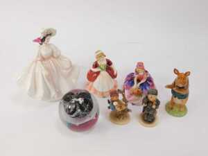 A group of collector's ceramics, comprising a Royal Doulton figure, modelled as Sunday Best HN2698, Monica HN1467, Valerie HN2107, together with two Goebel Hummel figures, a Beswick pottery figure modelled as David PP3, and a glass paperweight. (7) - 2