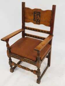 A set of four 20thC oak armchairs, comprising carver and three singles, each with carved and raised back bearing initials/shield possibly H, with later cushions. (4) - 4