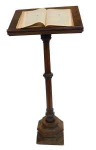 A Victorian oak lectern, the box sloped top raised on an octagonal column and base, 160cm high, 70cm wide, 32cm deep, together with a Churchman's Family Bible New Testament with commentary. (2) (AF)