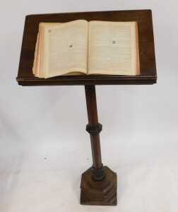 A Victorian oak lectern, the box sloped top raised on an octagonal column and base, 160cm high, 70cm wide, 32cm deep, together with a Churchman's Family Bible New Testament with commentary. (2) (AF) - 2