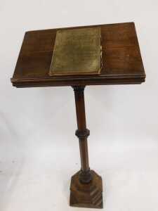 A Victorian oak lectern, the box sloped top raised on an octagonal column and base, 160cm high, 70cm wide, 32cm deep, together with a Churchman's Family Bible New Testament with commentary. (2) (AF) - 3