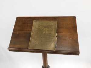 A Victorian oak lectern, the box sloped top raised on an octagonal column and base, 160cm high, 70cm wide, 32cm deep, together with a Churchman's Family Bible New Testament with commentary. (2) (AF) - 4