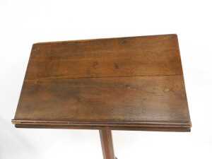 A Victorian oak lectern, the box sloped top raised on an octagonal column and base, 160cm high, 70cm wide, 32cm deep, together with a Churchman's Family Bible New Testament with commentary. (2) (AF) - 5