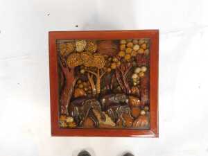 An Eastern carved hardwood coffee table, the glazed top enclosing a panel decorated with elephants and flowers, on out splayed legs, 43cm high, the top 50cm x 50cm. - 3