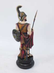 A plaster sculpture modelled as a Roman Centurion, with dagger, on a circular socle, 70cm high. (AF) - 2