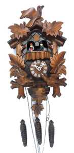 A 20thC oak cuckoo clock, with maple leaf and bird decoration, 25cm high, with weights and pendulum.