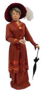 A mannequin modelled as Emmeline Pankhurst, wearing red velvet dress and hat, the plaster mannequin 174cm high. (AF)