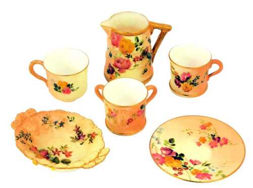 A group of Royal Worcester blush ivory porcelain, comprising miniature tyg, 4cm high, jug, tea cup and saucer, coffee cup and twin handled dish.