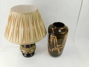 A West German pottery vase, of cylindrical form decorated with abstract line decoration against a mottled glaze ground, 38cm high, together with a brown glazed pottery two handled table lamp, 38cm high, with shade. - 2
