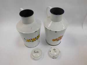 A pair of French enamel milk jugs, each with a lid and decorated to the front with transfer printed flowers, 40cm high. - 2