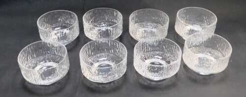 A set of eight Whitefriars style glass dishes, or sundae bowls, each with bark effect decoration, 10cm diameter.