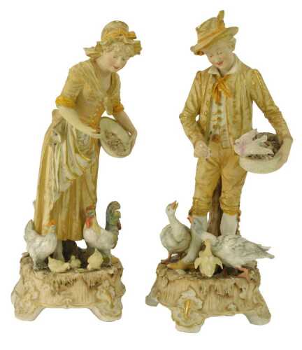 A pair of 19thC Continental blush porcelain figures, modelled as a male and female feeding geese and a hen and cockerel, impressed No.147 and 148, 38cm high.