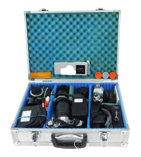 Camera and optical equipment, to include a Canon AE-1 SLR camera, a Canon AL-1 camera, various lenses, to include a Tamron 35-135mm CF Tele Macron lens, a Tamron 24mm lens, flash meters, two tele-converters, Flashgun, etc., contained in a metal case.