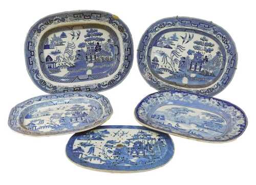 Three 19thC blue and white Willow pattern meat platters, together with a 19thC Staffordshire platter, and a Willow pattern drainer, 35.5cm wide. (5)