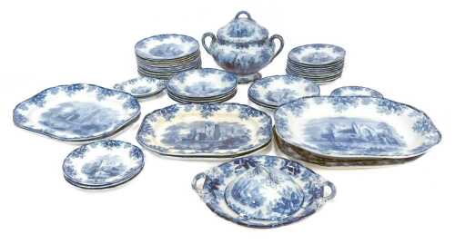A Copeland late Spode pottery part dinner service, decorated centrally with ruins with a leaf and acorn border, to include meat plates, twin handled soup tureens, soups bowls, side dishes, etc.