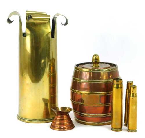 Trench art. A brass shell case modelled as a vase, 24cm high, three cartridge cases, together with a copper and brass container modelled as a barrel and a miniature copper jug.