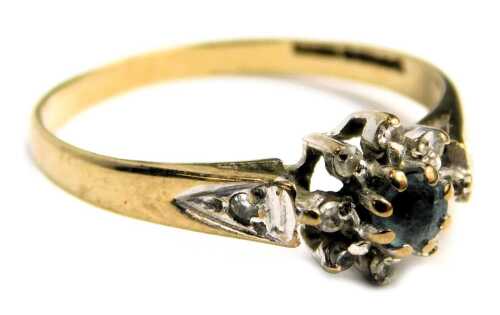 A 9ct gold cluster dress ring, set with aquamarine and cz stones, with tiny cz set shoulders, in white gold, on a yellow metal band, ring size J&frac12;, 1.2g all in.