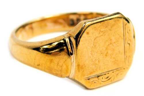 A 9ct gold signet ring, the rectangular ring panel with canted corners and floral scroll border, on a plain band, maker LW, Birmingham 1982, ring size Q&frac12;, 5.5g all in.