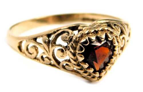 A 9ct gold smoky quartz dress ring, the heart shaped pendant set with central smoky quartz, in a raised leaf moulded border with vine twist, ring size K, 1.9g all in.
