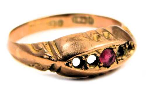 A 9ct gold dress ring, the boat shaped top with central garnet and single diamond, three stones missing, on a scroll design band, ring size N, 1.5g all in.