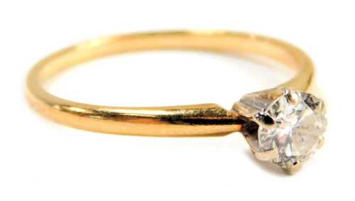 A diamond solitaire dress ring, the round brilliant cut diamond in a six claw setting, approx 0.40ct, raised white gold shank, on a yellow metal band, stamped 14k, ring size P&frac12;, 1.9g all in.