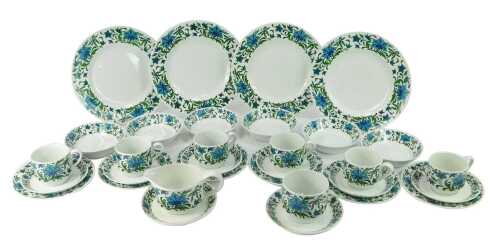A Midwinter part tea and dinner service in the Spanish Garden pattern, comprising four dinner plates, six breakfast bowls, six teacups, nine saucers, milk jug, sugar bowl, and six side plates.
