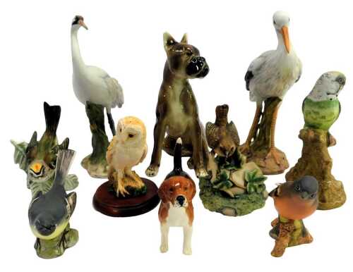 Two Beswick bisque porcelain birds, comprising Chaffinch 991 and Grey Wagtail 1041, together with a Beswick model of a dog, Border Fine Arts figure of a bird, etc. (1 tray)