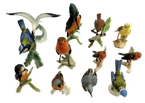 A group of Goebel matt porcelain birds, to include a kingfisher on a branch, 18cm high, seagull riding a wave, 12cm high, robin, etc. (a quantity)