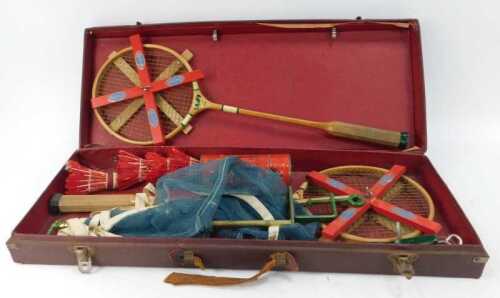An Arena table badminton set, comprising two racquets, four shuttlecocks, shuttlecock case and net, contained in a burgundy canvas case, 60cm wide.