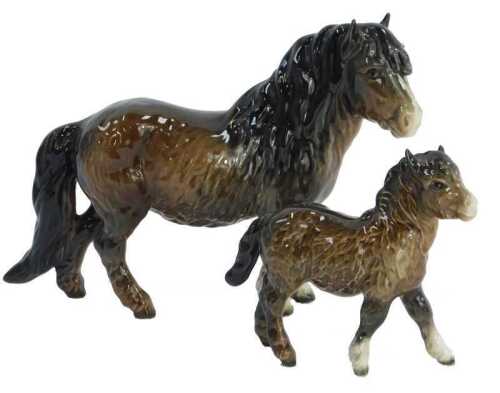 A Beswick pottery figure modelled as a Shetland pony, 14cm high, and foal, 10cm high. (AF)