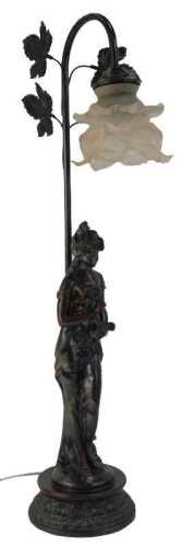 A 20thC table lamp, with frosted pink shade, the lamp base with leaf decoration and the stem surmounted by a figure of a lady in flowing dress, on socle base, 64cm high.