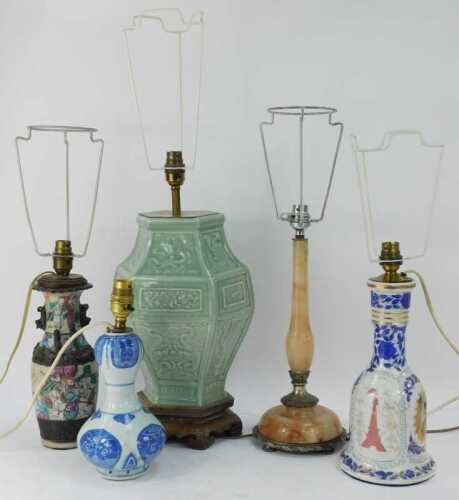 A group of Oriental and other table lamps, to include a celadon lamp decorated with dragons, etc., on hardwood base, 47cm high, together with a blue and white porcelain gourd table lamp, 28cm high, etc.