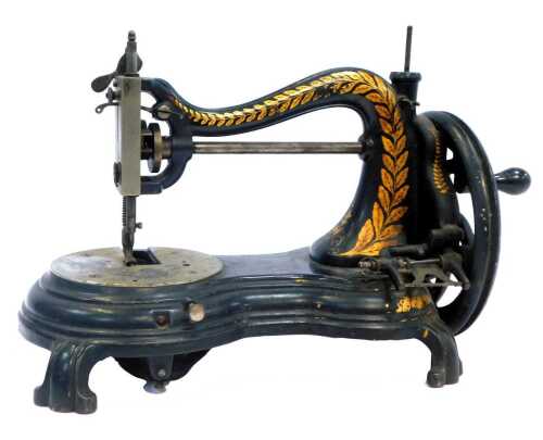 A late 19thC Jones hand operated cast iron sewing machine, with gilt heightened leaf decoration, 27cm high.