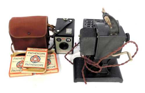 A Pathescope 9.5mm projector, together with various safety film reels, together with a Kodak Brownie Model 1 camera, and various 45rpm singles.