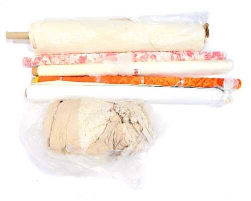 Various rolls of fabric, chiefly curtain material, and lining material. (a quantity)
