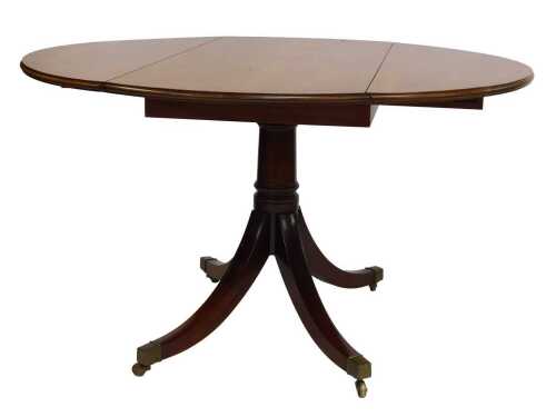 A 20thC mahogany drop leaf table, the circular top with a moulded edge, on a turned column, on out splayed legs with brass capped castors, 76cm high, 123cm wide, 57cm deep, 127cm extended.