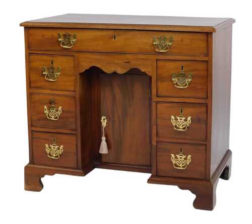 A 19thC style mahogany kneehole desk, the top with a moulded edge above one long and six short drawers, with cupboard to base, on bracket feet, 81cm high, 91cm wide, 53cm deep. (AF)