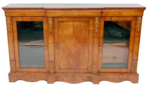 A Victorian figured walnut, inlaid and ormolu mounted credenza, the breakfront top above a panelled cupboard flanked by two glazed cabinets with shelf, 105cm high, 182cm wide, 44cm deep.