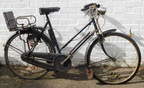 A Triumph vintage bicycle, with headlamp.