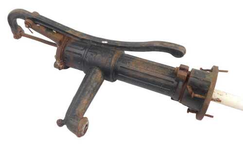 A cast water pump, painted black, 62cm high.