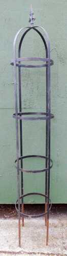 A cast and black painted metal garden obelisk, four tier, 230cm high.