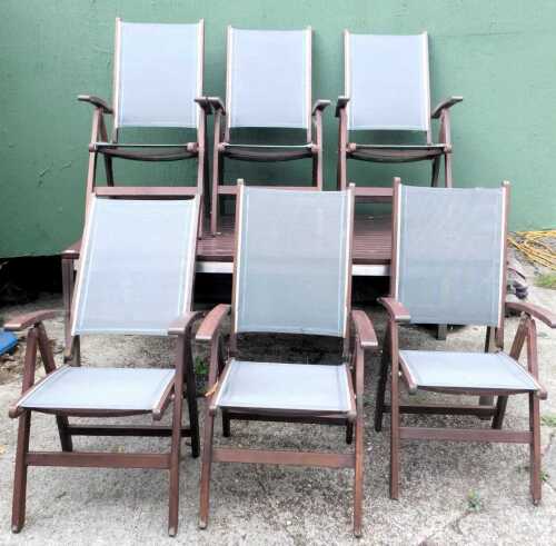 A wooden garden table, the rectangular trestle top table, with six chairs, on metal framed base, 78cm high, 200cm wide, 100cm deep.