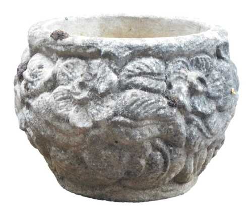 A composition planter, of circular form carved with various motifs, 38cm high, 47cm diameter.